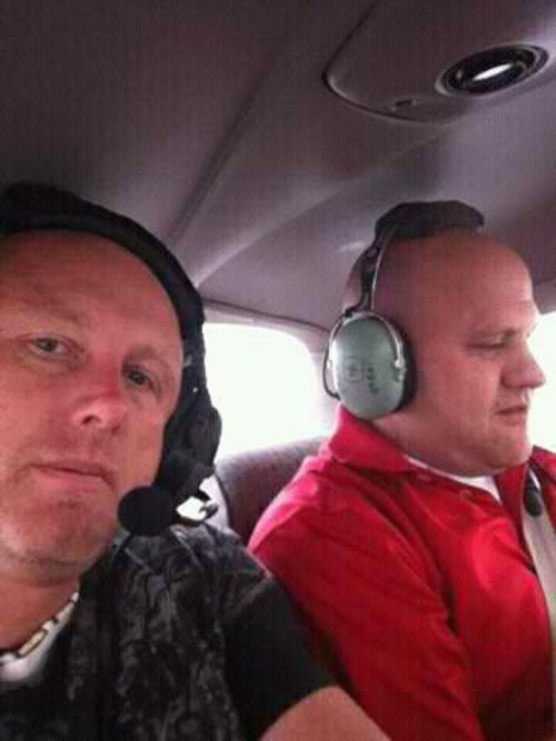 Chad Wade (left) and Justin Yates aboard their flight just before it crashed ... - planedead_060311~1