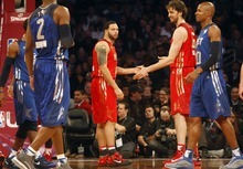 Photo by Chris Detrick | The Salt Lake Tribune 
Utah Jazz's Deron Williams high fives Pau Gasol during the second half of the 2011 NBA All-Star game at the Staples Center Sunday February 20, 2011.    The West won 148-143.