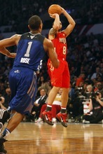 Photo by Chris Detrick | The Salt Lake Tribune 
Utah Jazz's Deron Williams shoots over Derrick Rose during the second half of the 2011 NBA All-Star game at the Staples Center Sunday February 20, 2011.    The West won 148-143.