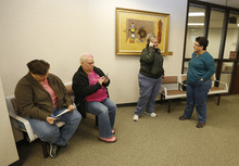   Patsy Carter left, Raylynn Marvel, 2nd left, from Orem, Utah,  2nd right, and Arlene Arnold 2nd right, Loreen Major right, from Lehi, Utah try and decide what to do outside the offices of the Utah County Clerk and Auditor office after they were rejected for a marriage license  as a lesbian couple on Dec. 20, 2013 in Provo, Utah. A federal Judge on Friday struck down Utah's ban on same sex marriage saying the law violates the U.S. Constitution.  (Photo by George Frey  |  Special to the Tribune)  