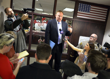   Keith Johnson | The Salt Lake Tribune

Utah Sen. Jim Dabakis stands on a chair outside the Salt Lake County clerks office, Friday, December 20, 2013, to explain to the crowd gathered outside that the office will close until Monday. Hundreds flocked to the office seeking marriage licenses after a federal judge in Utah Friday struck down the state's ban on same-sex marriage, saying the law violates the U.S. Constitution's guarantees of equal protection and due process.  