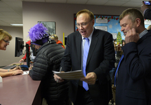   Scott Sommerdorf   |  The Salt Lake Tribune
Utah State Senator Jim Dabakis, center deals with the paperwork of a marriage license as his partner Stephen Justesen waits at right as others also see the clerks at the marriage license division offices at the Salt Lake County offices, Friday December 20, 2013.  