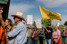   Trent Nelson  |  The Salt Lake Tribune
A group of people listen to San Juan County Commissioner Phil Lyman in Blanding's Centennial Park on Saturday, May 10, 2014, prior to an ATV ride into Recapture Canyon, closed to motorized use since 2007 to protect the 7-mile-long canyon's prehistoric sites.  