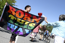   Keith Johnson | The Salt Lake Tribune

Andres Bordero, facing, receives support from a member of Mormons Building Bridges during the Utah Pride Festival parade in Salt Lake City, June 2, 2013.   
