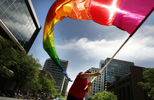   Scott Sommerdorf  |  The Salt Lake Tribune             
The 2014 Gay Pride Festival is this weekend with the parade June 8. In this 2012 photo, Randy Myers waves a huge rainbow flag near the end of the annual Gay Pride Parade through downtown Salt Lake City.  