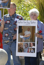   Leah Hogsten  |  The Salt Lake Tribune
Perry and Jana Tucker listen to their daughter Melinda Castellanos talk about her brother Joey Tucker's shooting death in August 2009 at the Families Speak Out On Police Violence rally Saturday, October 4, 2014, at the Matheson Courthouse.   
