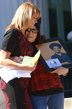   Leah Hogsten  |  The Salt Lake Tribune
Sisters Cindy Moss, left, and Susan Hunt bear hug each other after Moss' speech to the crowd about the shooting death of Hunt's son, Darrien Hunt at the Families Speak Out On Police Violence rally on Saturday at the Matheson Courthouse.  
