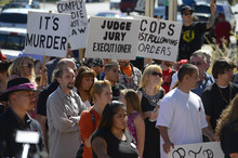  Leah Hogsten  |  The Salt Lake Tribune
Over a dozen families whose families have been killed or shot by police filled the crowd at the Families Speak Out On Police Violence rally Saturday, October 4, 2014, at the Matheson Courthouse.   