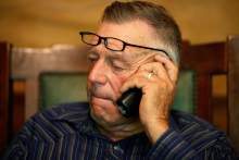   File-This Saturday, April 5, 2014 file photo shows Cliven Bundy talks on the phone at his ranch near Bunkerville Nev. Dave Bundy the son of Cliven Bundy a rural Nevada cattle rancher fighting government efforts to remove his cattle from disputed grazing areas northeast of Las Vegas was detained by federal agents. (AP Photo/Las Vegas Review-Journal, John Locher,File)  