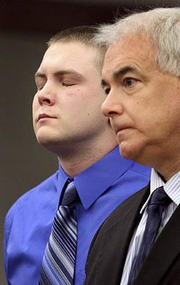Jeremy Ryan Reed, left, stands next to his attorney, Ed Brass, in 3rd District Court on Friday, when Reed pleaded guilty to homicide in the death of a teenager.