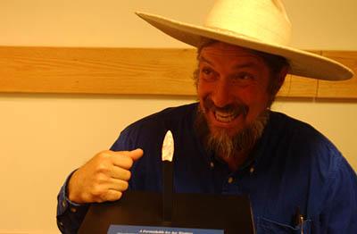 David Holladay with the Boulder Clovis point he presented to the Anasazi State park Museum in Boulder Monday night.