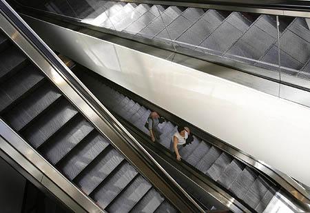 With only three stores left open, the escalators at the Crossroads Plaza mall have very little traffic and virtually lead to nowhere.