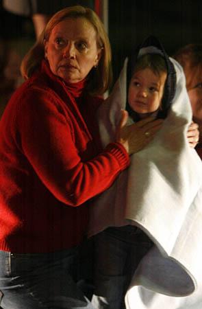 Anne Bagley holds her granddaughter, Madeline Bagley, 4. They were in the mall during the shootings.