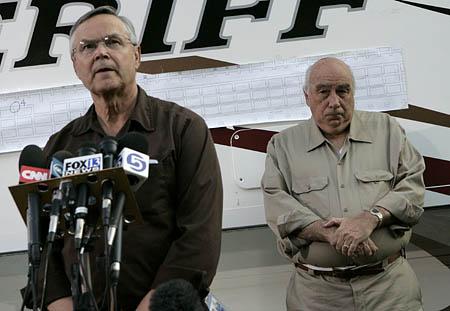 Robert Murray, right, chief executive of Murray Energy Corp., right, stands behind Richard Stickler, Assistant Secretary of the Dept. of Labor and director of Mine Safety & Health Administration, during a news conference at the entrance to the Crandall Canyon Mine, in northwest of Huntington, Utah on Monday, Aug. 20, 2007. The once-outspoken Murray had been noticeably absent from meetings with relatives and from news briefings since three rescuers were killed last week in a tunnel collapse.