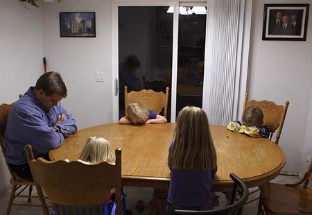They pray a lot in the Lappi home. At the table before each meal. In the van before each commute into the city. And finally, each evening just before bedtime, the children kneel with their father on the juice- and milk-stained carpet in the family room.