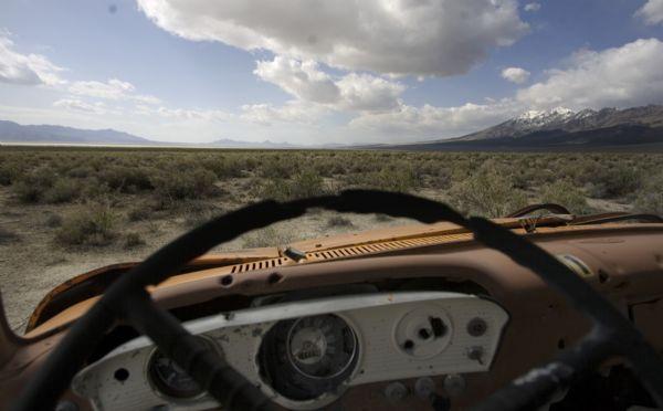 The view of sagebrush from an old moving truck rusting away along the western portion of the Great Salt Lake Tueday, April 28, 2009. The truck, which two-thirds are missing, is now a common target for shooters. (FOR WHARTONS WEST DESERT STORY). Jim Urquhart/The Salt Lake Tribune; 4/28/09