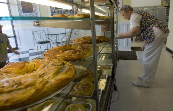 After 34 years in business, Leslie's Bakery has moved down the street to a new home. The popular Holladay bakery had to relocate as part of construction that is happening on the Holladay Village Center.  14 year employee Nadine Chase stocks the display cases with freshly baked goods a the new location at 2308 Murray-Holladay Road  Friday morning.   Al Hartmann/The Salt Lake Tribune   5/22/09