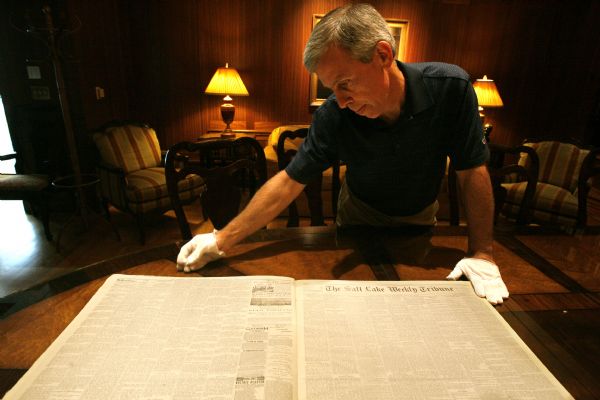 Rick Egan/The Salt Lake Tribune

John Herbert thumbs through an old issues of The Salt Lake Tribune at the special collections at the Marriott Library at the University of Utah last week. MediaNews Group has donated the entire bound volumes of the Salt Lake Tribune from 1872-2003 to the U., appraised at $650,000. The U. is in the process of digitizing these old papers into a searchable database.