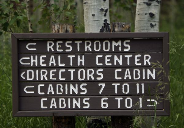 Camp Roger-  Wooden signs show the way at Camp Roger, near Kamas, Wednesday Jul 22, 2009.  Steve Griffin/The Salt Lake Tribune 7/22/09