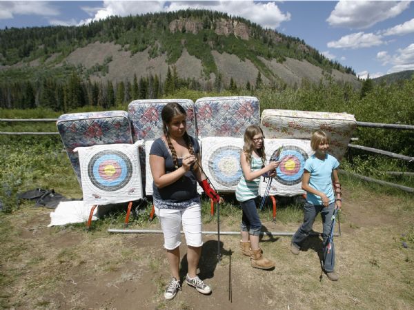 Camp Roger- Campers retrieve their arrows during archery lessons at