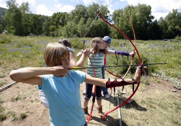 Camp Roger-  Campers take aim during archery lessons at Camp Roger, near Kamas, Wednesday Jul 22, 2009.  Steve Griffin/The Salt Lake Tribune 7/22/09