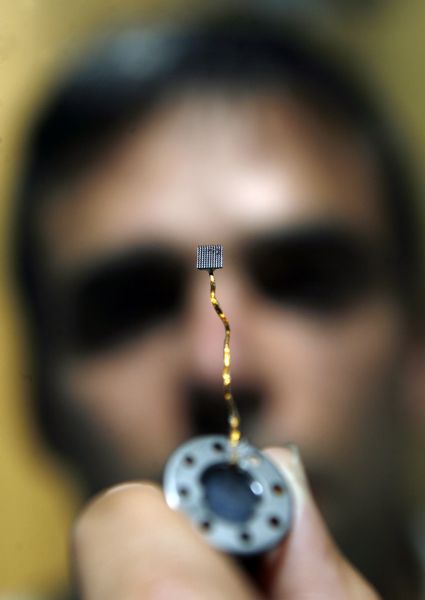 Salt Lake City - Andy Gotshalk, CEO of Blackrock Microsystems shows off the micro electrode array which when implanted into the brain can collect signals for a number of applications.  Nestled in Research Park, the University of Utah is a leader in creating companies that capitalize on the research done by faculty such as Blackrock which gets products out of the lab and into the public sooner. Photo by Francisco Kjolseth/The Salt Lake Tribune 7/29/2009