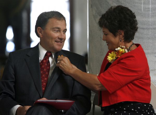 Salt Lake City -  Utah Lt. Governor Gary Herbert gets a little help with his boutonnière from his wife Jeanette Herbert during the Centenarian Celebration at the State Capitol  Friday Jun 26, 2009.  Steve Griffin/The Salt Lake Tribune 6/26/09