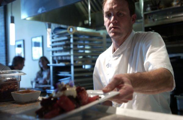 Adam Findlay prepares dessert at Pago restaurant Friday, July 31, 2009. The restaurant utilizes farmer-table approach, using local produce, eggs and Idaho beef. There about 20 entrees on each menu?breakfast, lunch and dinner.

Anna Kartashova / The Salt Lake Tribune