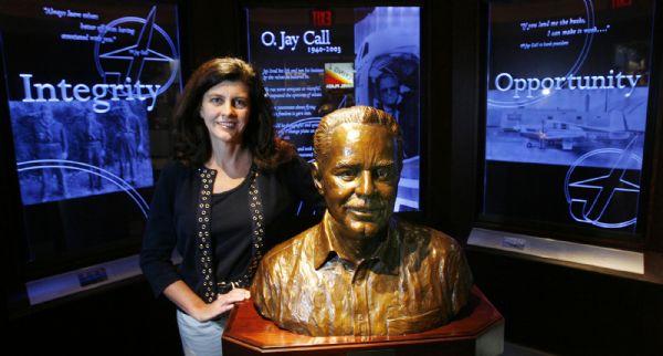 Ogden -  Crystal Call Maggelet, the CEO of Flying J, with a bust of her father and founder of Flying J, O Jay Call, in the museum in the Flying J offices in Ogden Monday Aug 3, 2009.  Steve Griffin/The Salt Lake Tribune 8/3/09