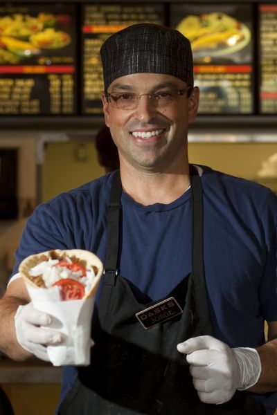 Owner Jorge Daskalakis holds a traditional the beef and lamb gyro ($6.48) at Dasks restaurant in Holladay Tuesday September 1, 2009. 

Photo by Chris Detrick/The Salt Lake Tribune