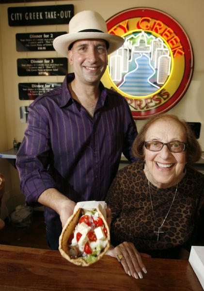 Salt Lake City -  City Greek Express restaurant owner George Furgis with his mother Ellen Vidialakis Furgis holding a gyro in the Salt Lake City store Wednesday Sep 2, 2009.  Steve Griffin/The Salt Lake Tribune 9/2/09