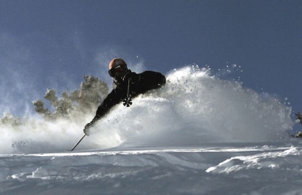 A skier braves the frigid temperatures to enjoy some deep powder on the Vertigo run at Solitude. 11/29/06 Jim Urquhart/Salt Lake Tribune
