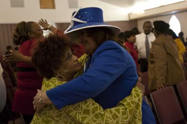 Photo by Chris Detrick  |  The Salt Lake Tribune 
Lori Lester, right, hugs Eloudis Crandall during the Sunday morning worship service at the Second Baptist Church in Ogden Sunday January 10, 2010.