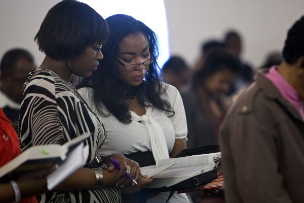 Photo by Chris Detrick  |  The Salt Lake Tribune 
Lena and Lesa Williams follow along in the Bible during the Sunday morning worship service at the Second Baptist Church in Ogden Sunday January 10, 2010.