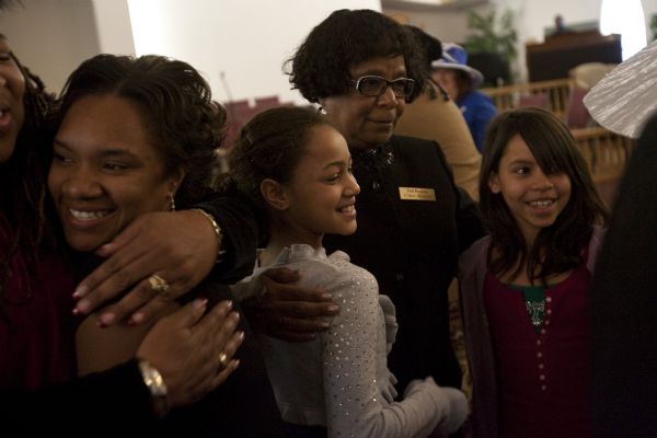 Photo by Chris Detrick  |  The Salt Lake Tribune 
Usher Tina Green hugs Kiara Barnwell, left, and Armani Henry during the Sunday morning worship service at the Second Baptist Church in Ogden Sunday January 10, 2010. At left is Deshante McKenzie.