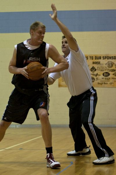 Photo by Chris Detrick  |  The Salt Lake Tribune 
Utah Flash assistant coach Mark Madsen guards Luke Nevill during a practice at the Boys and Girls Clubs of Ada County Monday January 4, 2010.