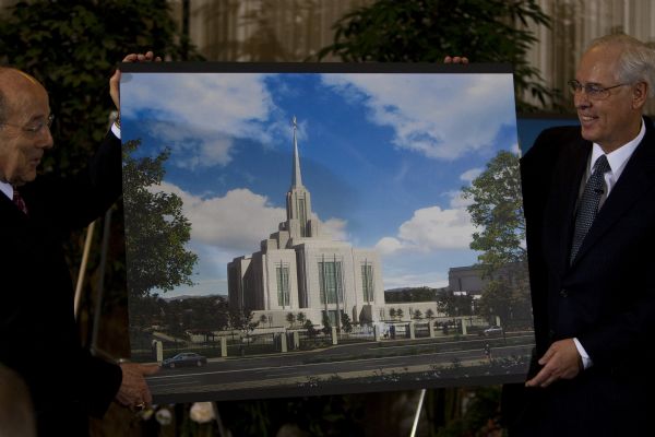 Photo by Chris Detrick  |  The Salt Lake Tribune
Bishop Keith B. McMullin, left, and Elder William R. Walker of the First Quorum of the Seventy show the aerial rendering of what the renovated Ogden Temple block will look like during a press conference at the Ogden Tabernacle Wednesday, February 17, 2010. The temple, the church's fifth one in Utah and a sister structure to one in Provo, was dedicated in 1972 by then-LDS President Joseph Fielding Smith.  

?The Ogden Utah Temple has been a beacon of faith in downtown Ogden for nearly forty years and has blessed those who have served and worshipped within its walls,? Elder Walker said. ?We hope these improvements will not only better serve Church members but also add to the beauty of downtown Ogden for all to enjoy.?

Elder Walker went on to explain that the temple?s entire exterior will be reshaped with new stone and art glass.  The entrance to the temple will also be moved from the west side to the east side, where it will face Washington Boulevard.

Inside the temple, some rooms will be reconfigured, but the core building design will remain the same.  As has been the case in renovations of other temples, old electrical, heating and plumbing systems will be replaced with modern, energy-saving equipment.  Other notable improvements include underground parking and a complete re-landscaping of the temple block with a major water feature.