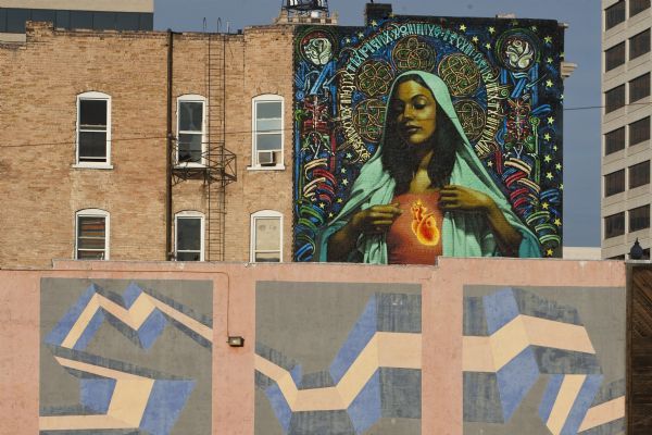 A 44x22 foot mural of the Virgin Mary on the east side of the building at 158 E 200 South Saturday, February 20, 2010. Two artists, El Mac and Retna, created the mural.