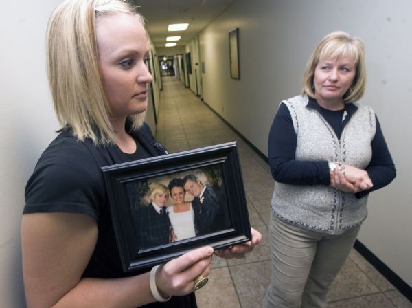 Al Hartmann  |  The Salt Lake Tribune   3/22/2010
Researchers and public health workers gathered Monday at the Utah Health Dept. to discuss the results of a study on who dies from prescription drugs in Utah.   Larah Kofoed, left, holds a photo of the three siblings in her family.  Pictured from left, Dominic Barnes, Larah Kofoed and Derek Barnes.  Derek died from a prescription drug overdose in June 2009.  Gayle Barnes, mother of the family at right.   The two atended the release of the study.