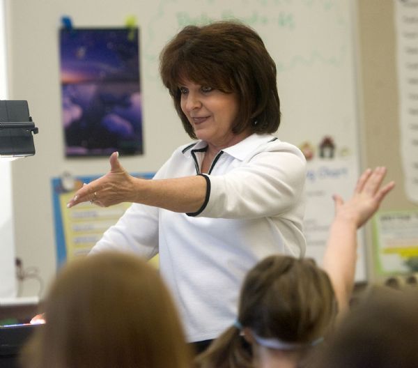 Al Hartmann  |  The Salt Lake Tribune  3/23/2010
Sharon Gallagher-Fishbaugh 2nd grade teacher at Dilworth Elementary in Salt Lake City is alive with expression and enthusiasm as she teaches reading and spelling to her class.     She was the 2009 Utah Teacher of the Year and wrote an essay on a positive memory of a former student.  The book 