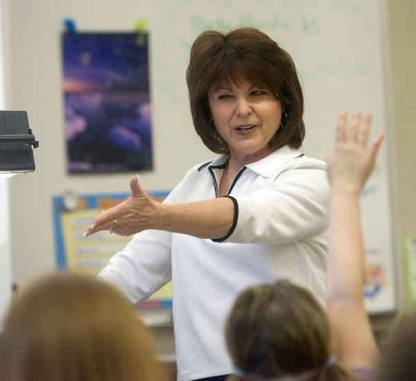 Al Hartmann  |  The Salt Lake Tribune  3/23/2010
Sharon Gallagher-Fishbaugh 2nd grade teacher at Dilworth Elementary in Salt Lake City is alive with expression and enthusiasm as she teaches reading and spelling to her class.     She was the 2009 Utah Teacher of the Year and wrote an essay on a positive memory of a former student.  The book 