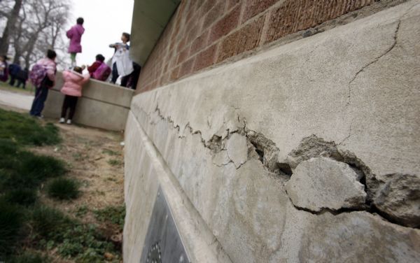 Francisco Kjolseth  |  The Salt Lake Tribune
Numerous cracks are visible at Midvale Elementary including one that travels a long section of the school's foundation as kids let out in March. Canyons School District could place up to $250 million bond on the June 22 ballot to pay to renovate or rebuild a number of schools. One of the first to rebuild would be Midvale Elementary School. The school turns 60 years old on April 20 and has had a substantial renovation.