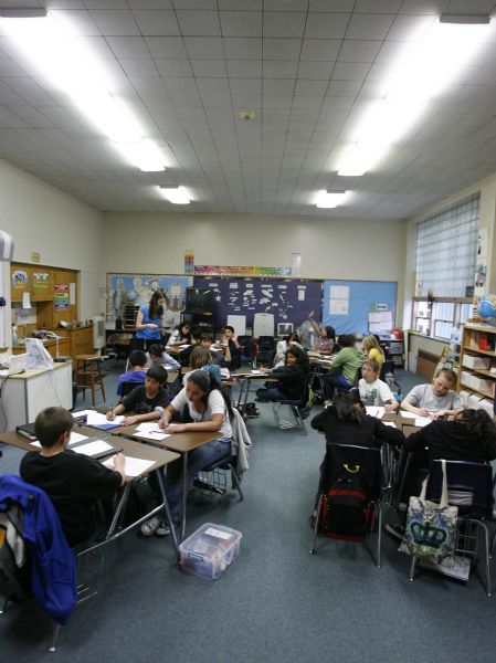 Francisco Kjolseth  |  The Salt Lake Tribune    
Midvale  - Angela Huntsman's sixth graders have class in their outdated classroom at Midvale Elementary on Tuesday, March 30, 2010. Canyons School District could place up to $250 million bond on the June 22 ballot to pay to renovate or rebuild a number of schools. One of the first to rebuild would be Midvale Elementary School. The school turns 60 years old on April 20 and has had a substantial renovation.