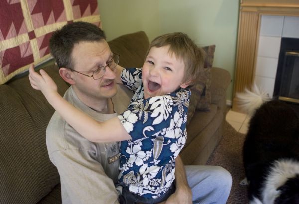 Al Hartmann  |  The Salt Lake Tribune   5/6/2010
Chris Gilbert cares for his six-year-old son Aiden who has Angelman Syndrome.  He and his wife Michelle work hard to provide what's best for Aiden.  Angelman syndrome is a life-long, neuro-genetic disorder that exhibits symptoms of developmental delay, lack of speech, seizures, inappropriate laughter, and walking and balance disorders. The Gilberts love for theirr child continues to motivate them to aggressively fundraise for the Angelman Syndrome Foundation, a non-profit committed to improving the lives of those with Angelman syndrome through research, education, and advocacy