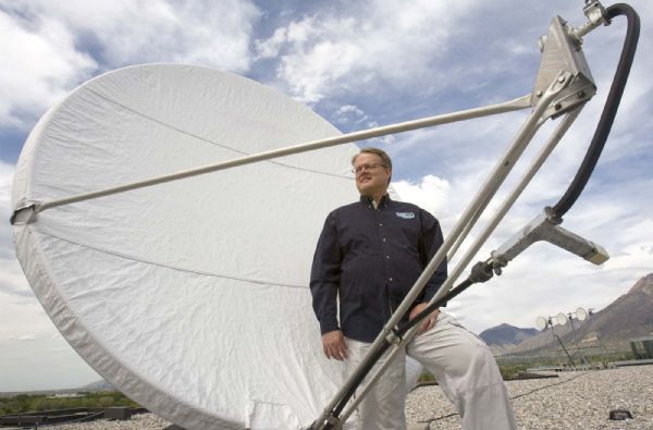 Paul Fraughton  |  The Salt Lake Tribune
President and CEO Rodney Tiede of Broadcast International stands next to a communications uplink antenna on the roof of the company's offices in Midvale. Monday, May 17,2010