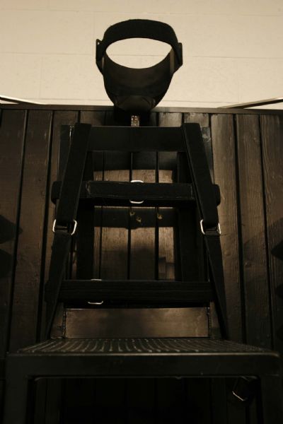 Trent Nelson  |  The Salt Lake Tribune
Draper - The execution chamber at the Utah State Prison after Ronnie Lee Gardner was executed by firing squad Friday, June 18, 2010. Four bullet holes are visible in the wood panel behind the chair. Gardner was convicted of aggravated murder, a capital felony, in 1985.