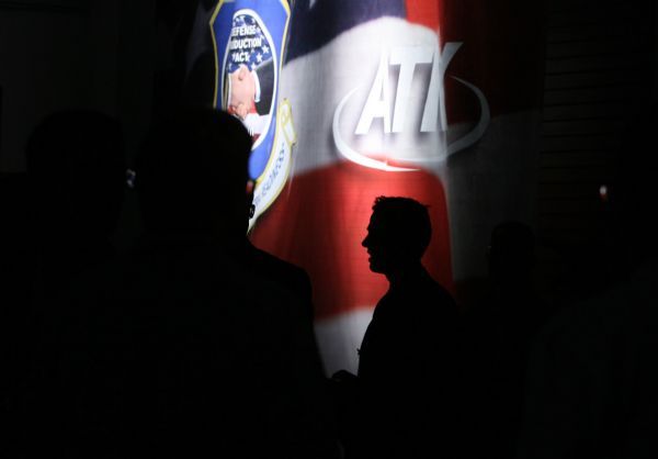 Leah Hogsten  |  The Salt Lake Tribune
An oversized American flag hangs from a wall behind an Alliance Techsystems employee listening to speeches at a Thursday ceremony marking the completion of the first of three advanced fiber placement machines that will build wing and fuselage parts for F-35 fighter jets. The program is expected to add 120 employees to the payroll at ATK's Clearfield facility.