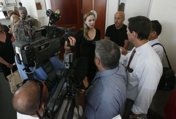 Rick Egan   |  The Salt Lake Tribune
Eugene Christopher Wright's wife, Bianca Pearman-Brooks, and David McCammon talk to the press after Eugene Christopher Wright's sentencing hearing, Friday, July 9, 2010. Wright was convicted by a jury for fatally shooting Utah County hockey coach and businessman Kenneth Dolezsar outside the Village Inn restaurant in Sandy in 2007.