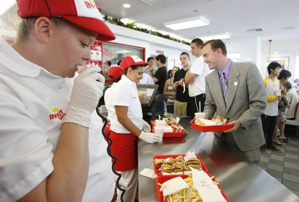 Leah Hogsten  |  The Salt Lake Tribune
WVC Mayor Mike Winder picks up his order.
The WVC City Council and mayor attended the VIP party on Tuesday evening before the In-N-Out Burger grand opening. In-N-Out Burger is opening two stores Wednesday in West Valley City and Riverton, bringing the grand total of Utah stores to 7.  
 WVC 7/20/10