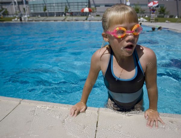 Jim Urquhart  |  The Salt Lake Tribune
Halle Rueckert, 8, of South Jordan, hauls herself out of the pool at the Oquirrh Park Fitness Center in Kearns. Voters recently defeated a $12 million bond for the fitness center that, among other things, would have covered the outdoor Olympic-sized swimming pool and added several amenities to the water park.